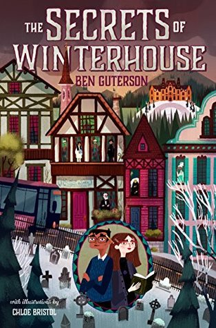 Cover of the book titled Secrets of Winterhouse by Ben Guterson. The cover features buildings in a village covered in snow, and there is a cemetery. There are people looking out the windows of various buildings. In the bottom middle there is an oval portrait of Elizabeth and Freddy, two main characters in the book.